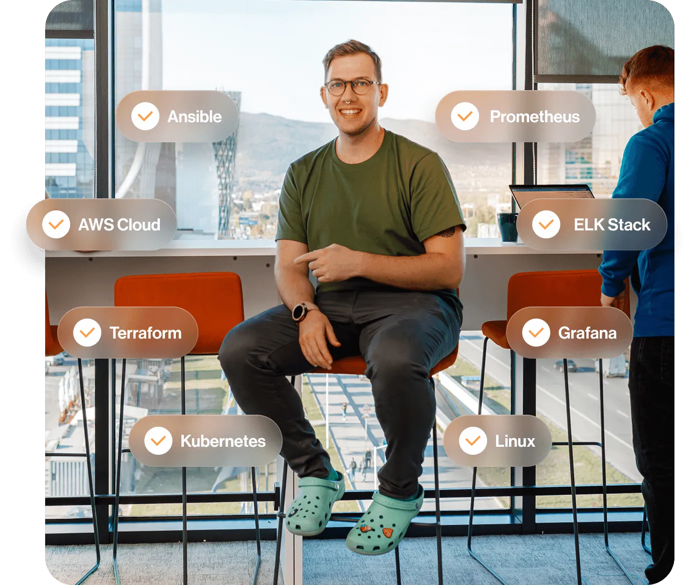 Person sitting with technology terms like Ansible, Kubernetes, and AWS Cloud displayed around.