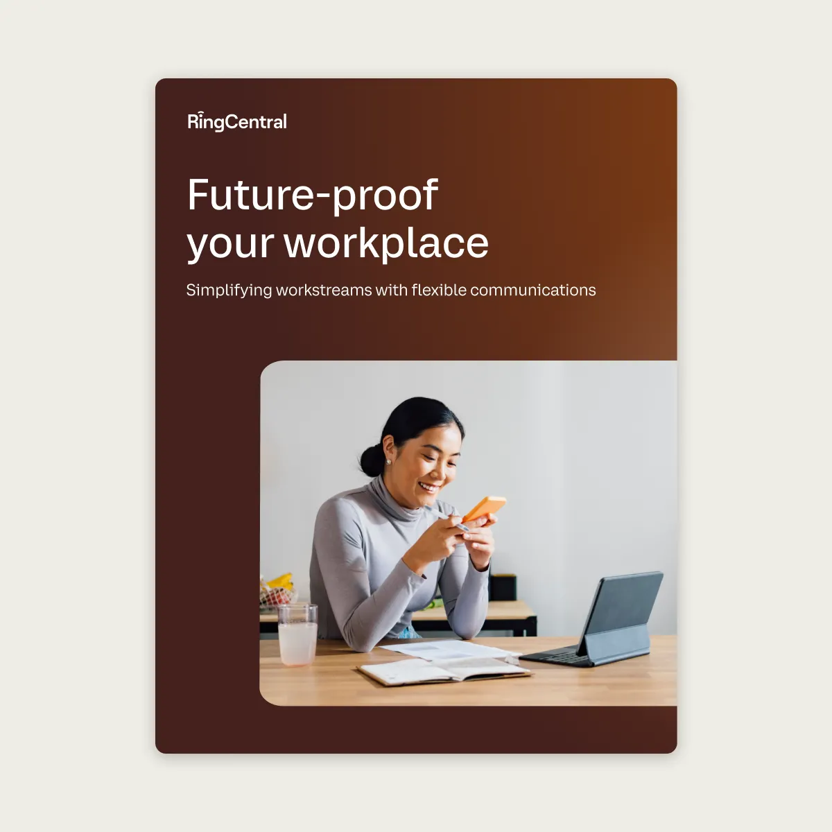 eBook cover: A woman smiling at her mobile phone while working