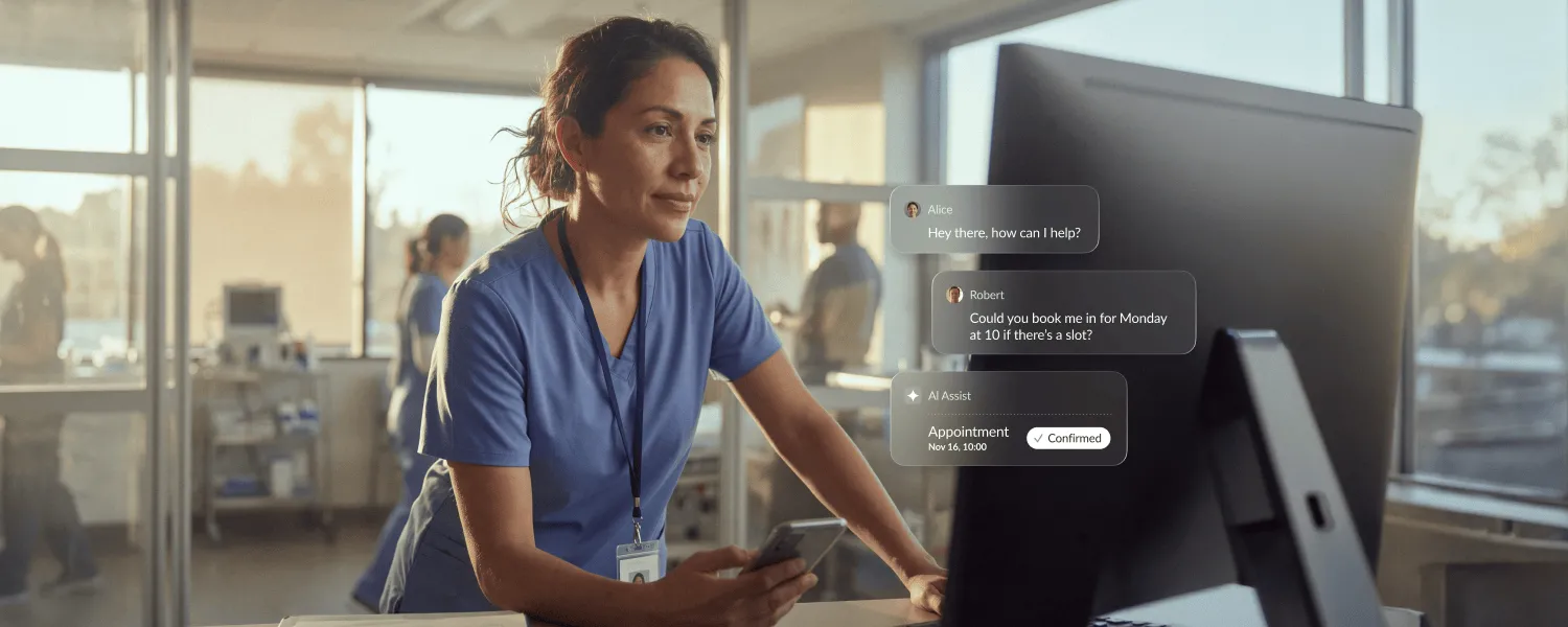 Healthcare professional scheduling appointments on a computer using RingCentral messaging in a clinic setting.