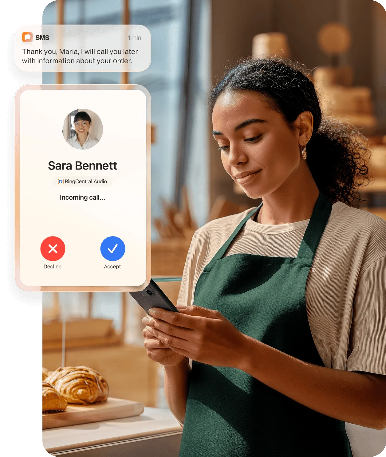 A woman holding a tablet while talking to a colleague using the RingCentral app