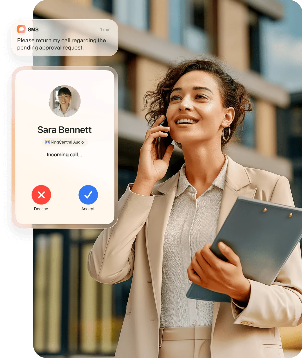 A woman holding a tablet while talking to a colleague using the RingCentral app