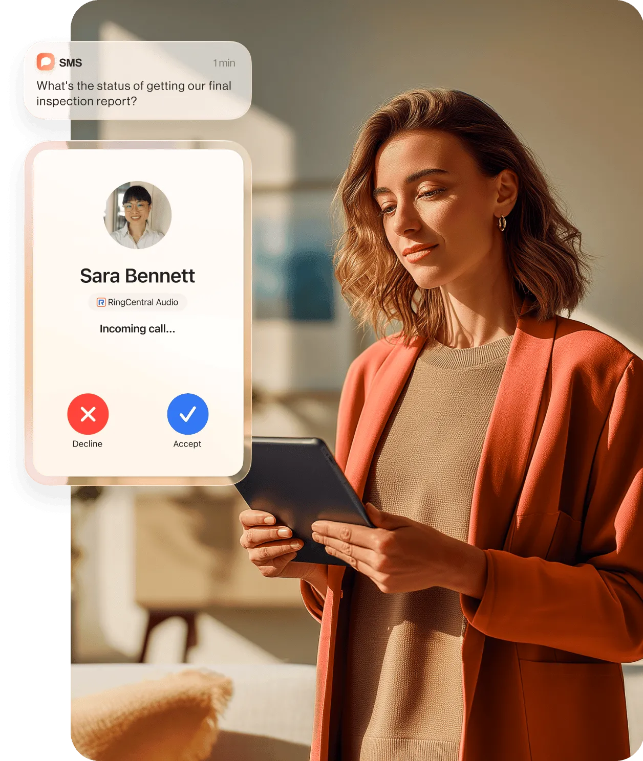A woman holding a tablet while talking to a colleague using the RingCentral app