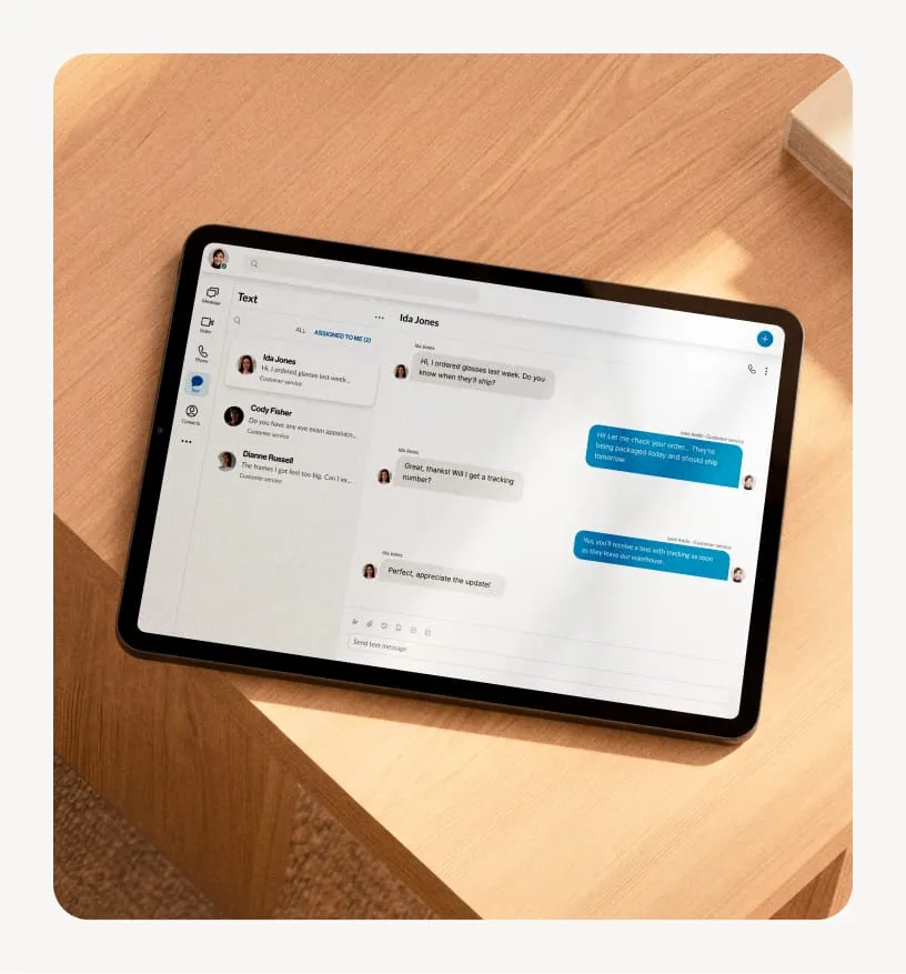 Tablet displaying RingCentral messaging interface on a wooden desk.