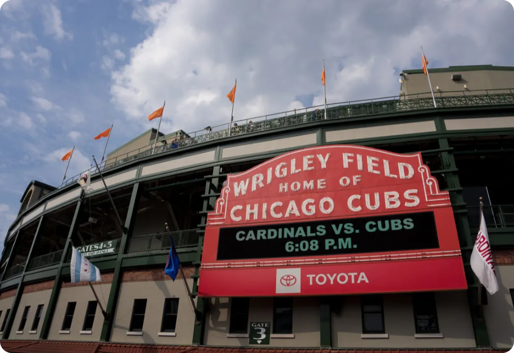 A panoramic view of Wrigley Field, home of the Chicago Cubs, showcasing the iconic stadium and surrounding area.