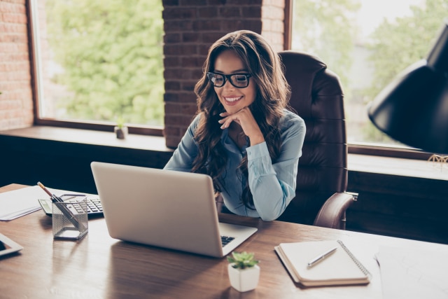 Female CIO working on laptop at her desk