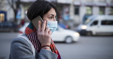 photo of a Young Woman With Face Mask Talking On The Phone.