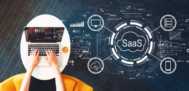 SaaS - software as a service concept with person using a laptop-937