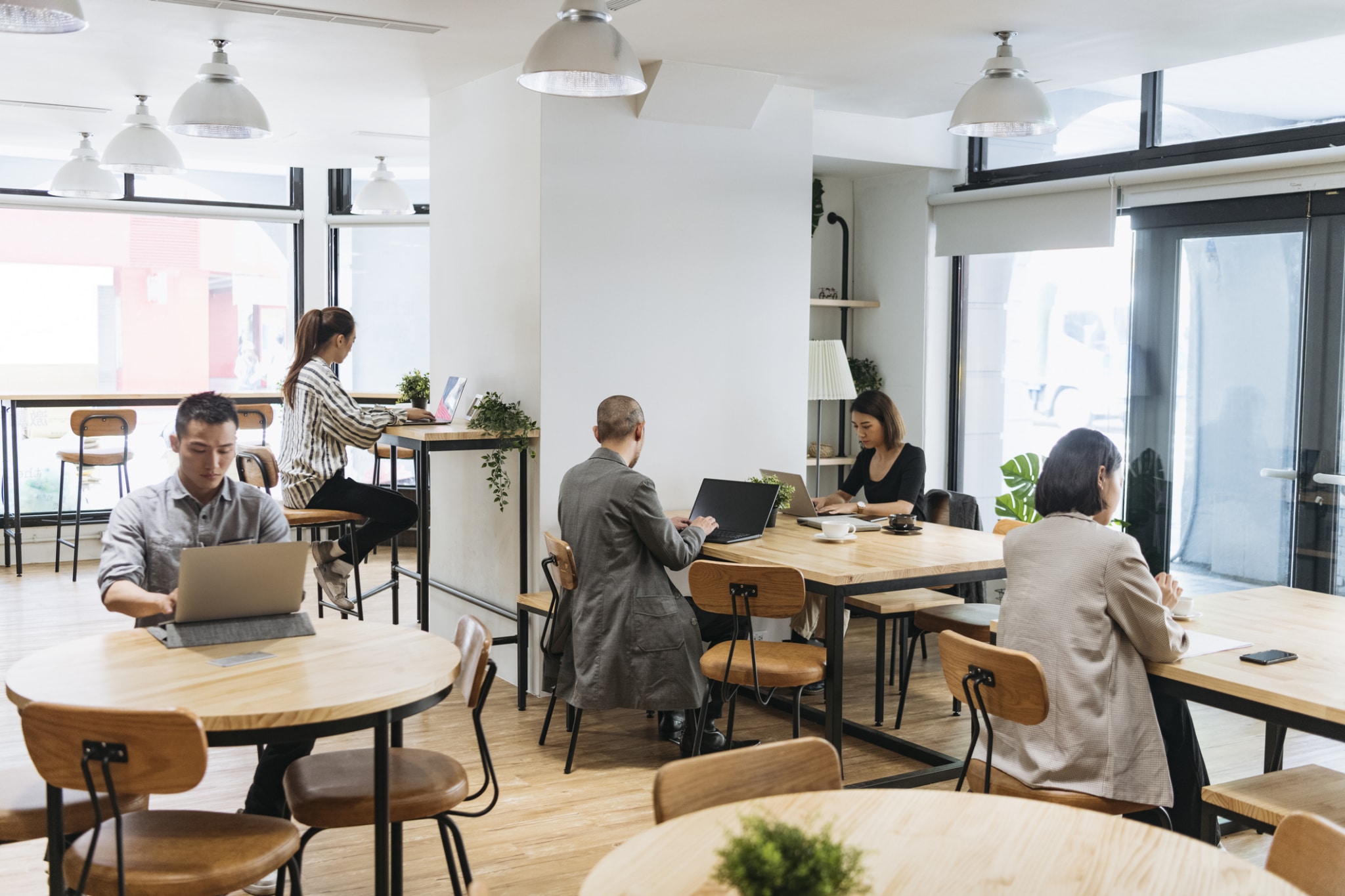 Hybrid workers working in a shared coworking space