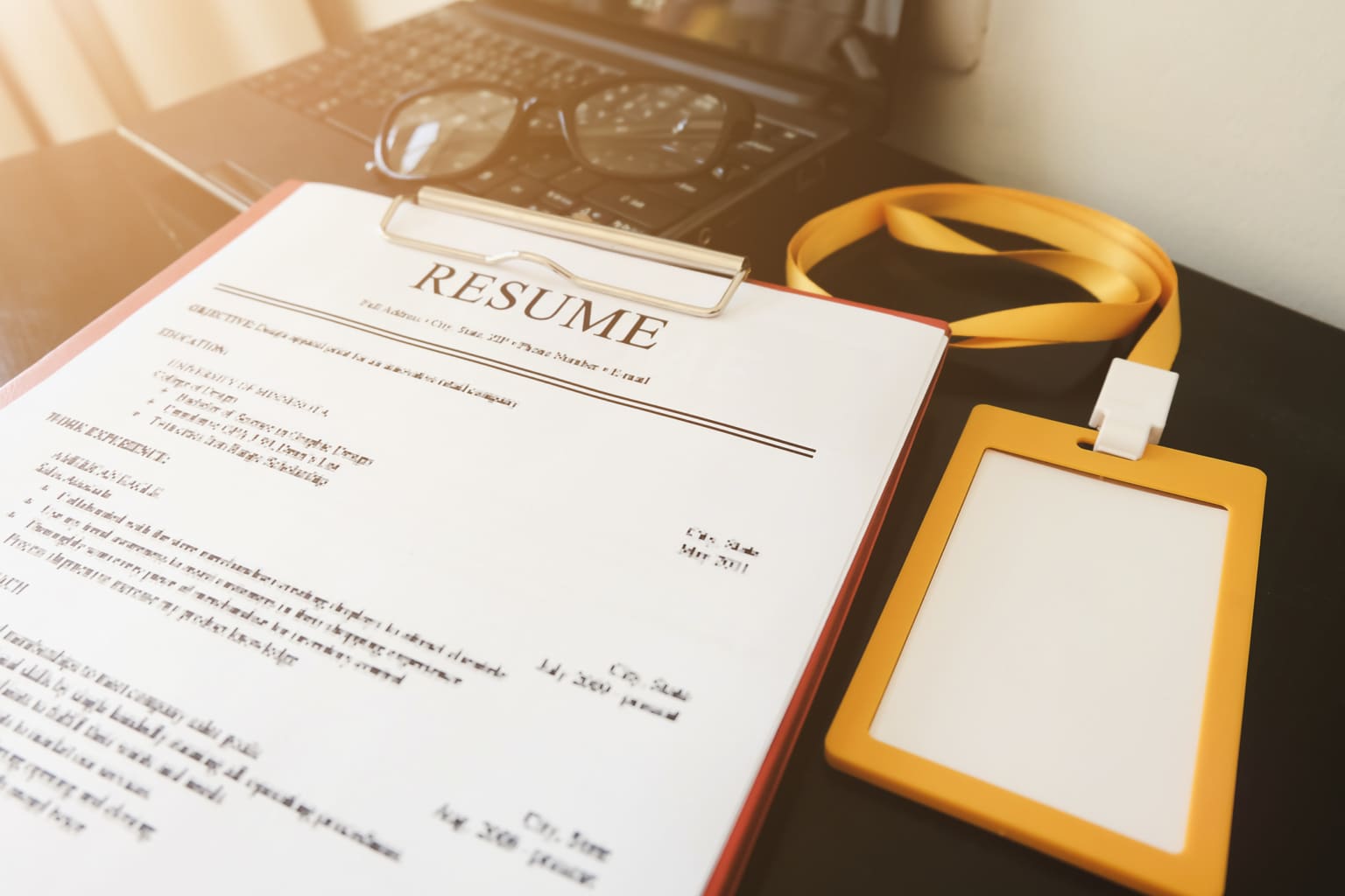 RingCentral-UK-Resume paper on a photo file on a desk