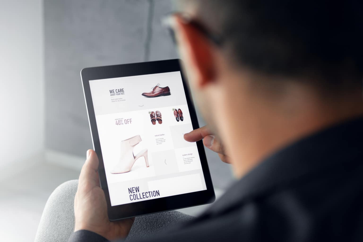 browsing an online shop on digital tablet which is selling shoes