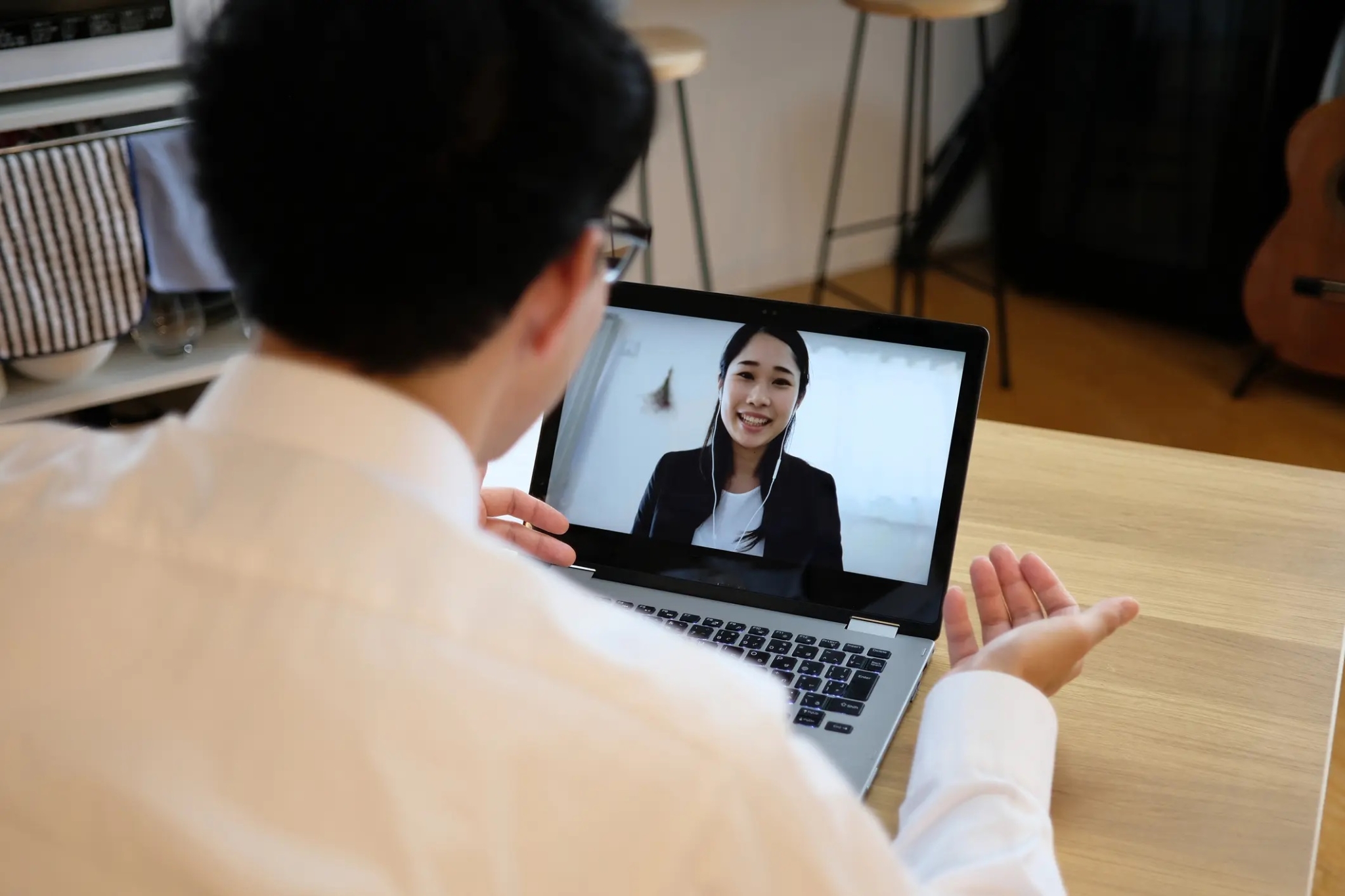A man speaking to his colleague while on a video call-388