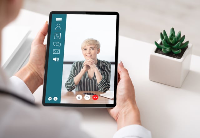 Businesswoman Making a Video Call on a Digital Tablet