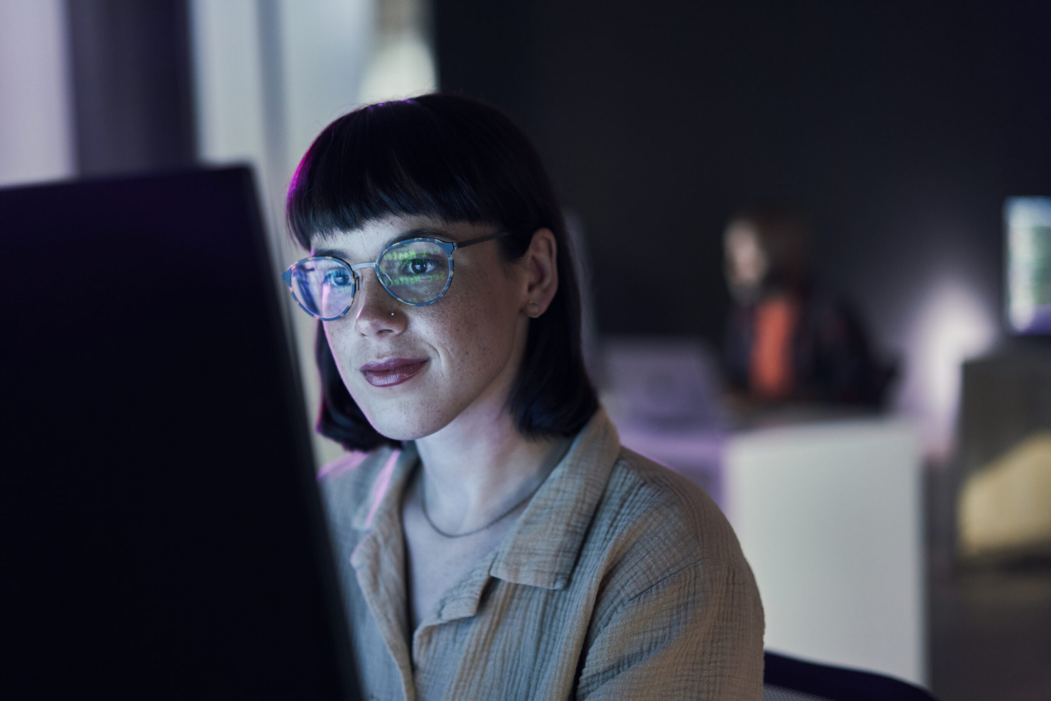 Business woman, computer seo work and coding of young employee with crypto and glasses. Digital code, female face and reading of a it employee at night planning with online hacker and ai data-575