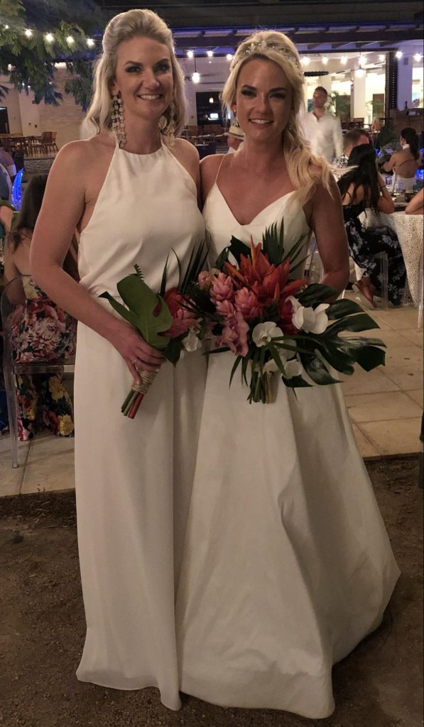 Grayleigh in her bridesmaid dress with her sister, the bride