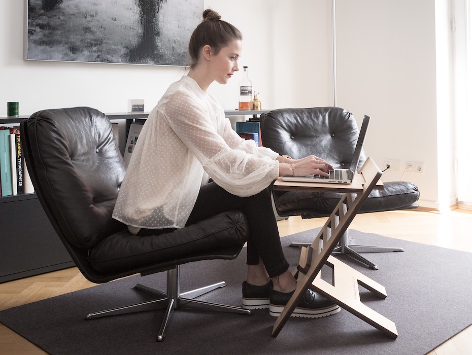 Woman working on flexible desk at home