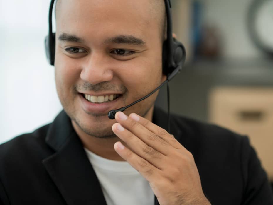 Young business asian man working call centre customer service agents. Businessman support operator with computer and headset in office.