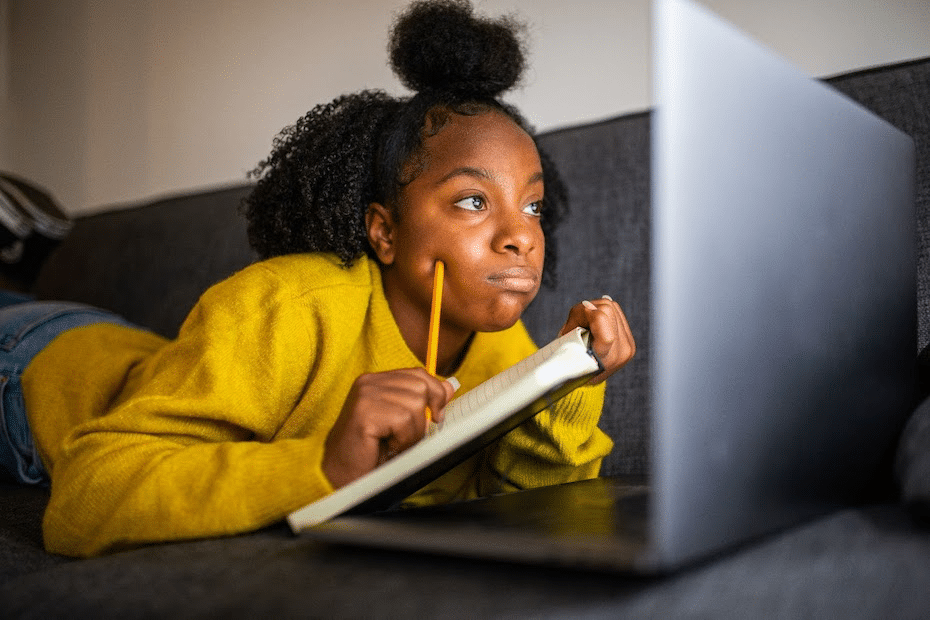 Young African American student learning remotely