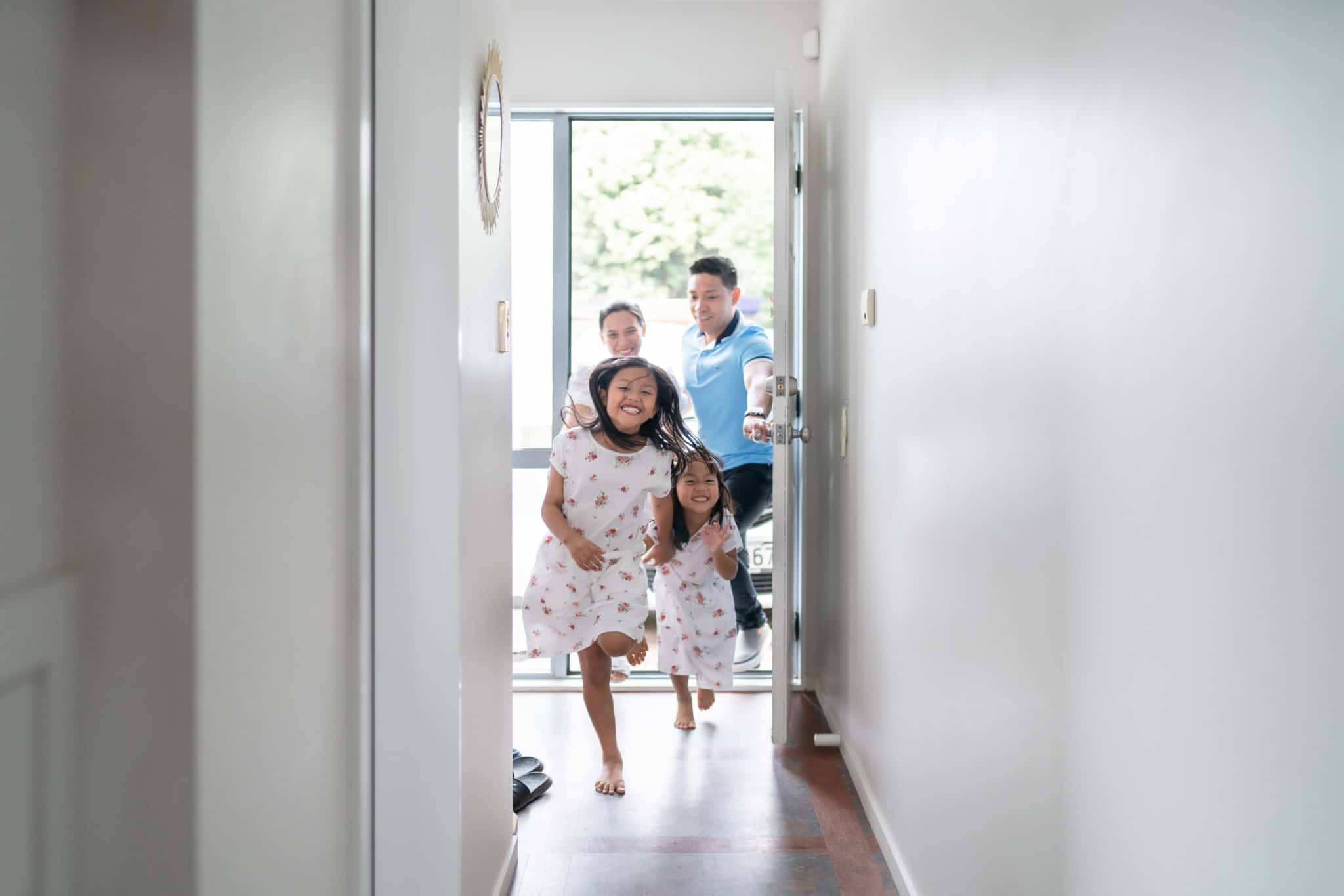 Family walking into their new home