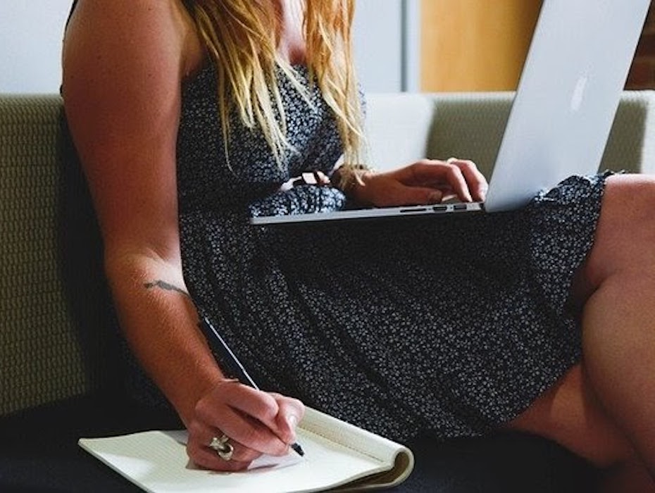 A financial services professional working on a laptop in a hybrid work environment