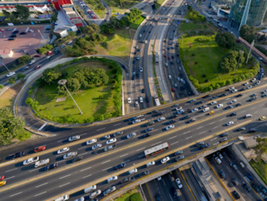 Aerial view of complex inter-state highway with cars driving