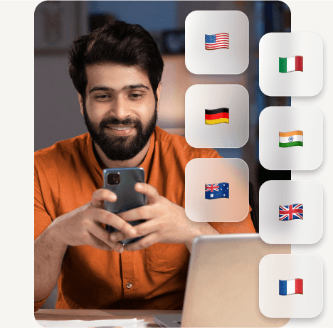 a man communicating via the RingCentral app on his mobile and laptop to countries like USA, Germany, Australia, Italy, India, United Kingdom, and France