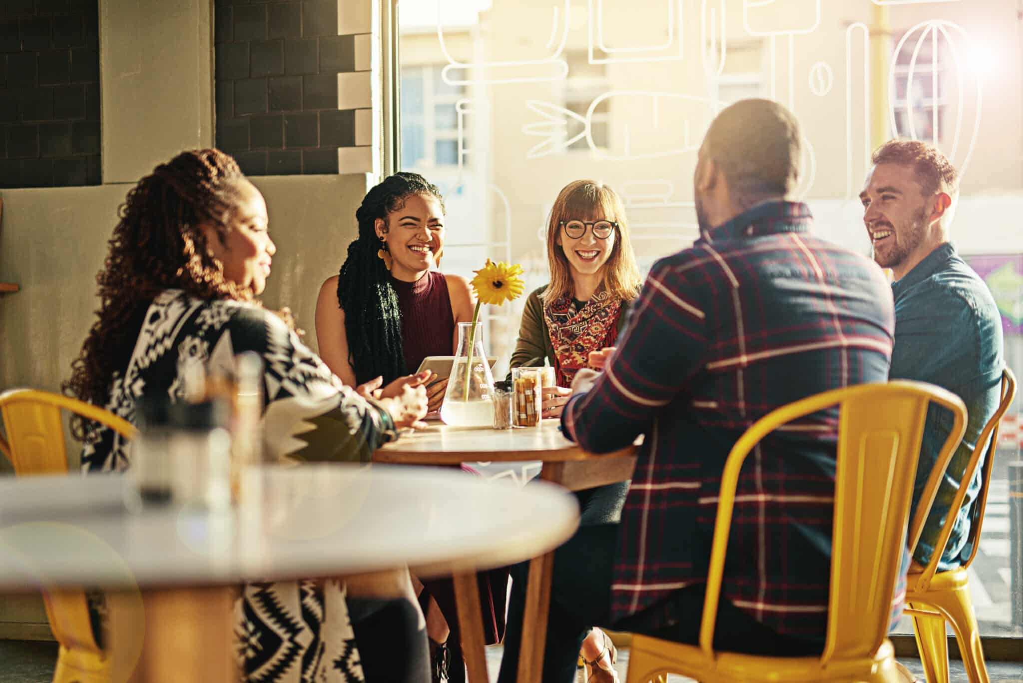 Cropped shot of friends hanging out in a cafe