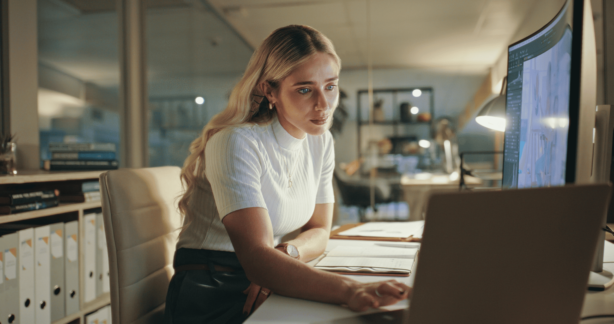 A female executive looking at AI insights on her computer