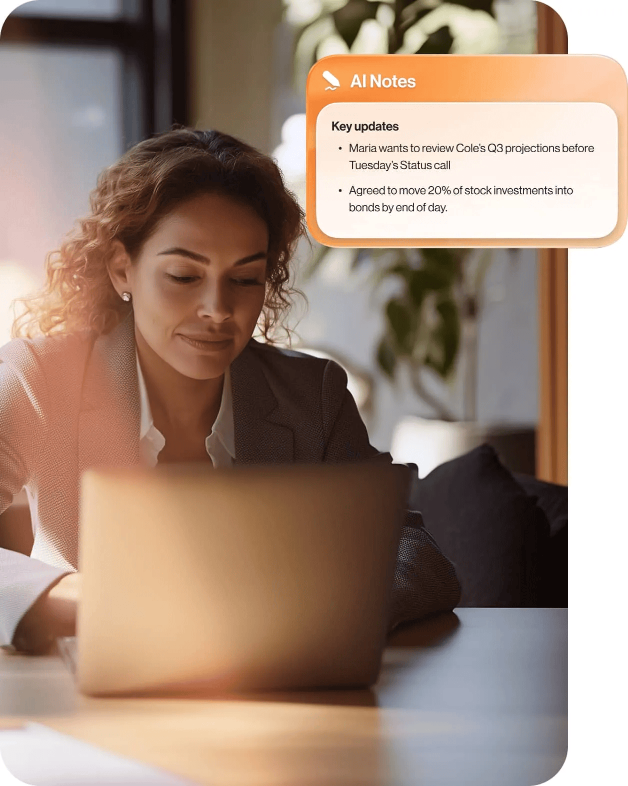 A woman works on her laptop while AI summarizes her meeting notes
