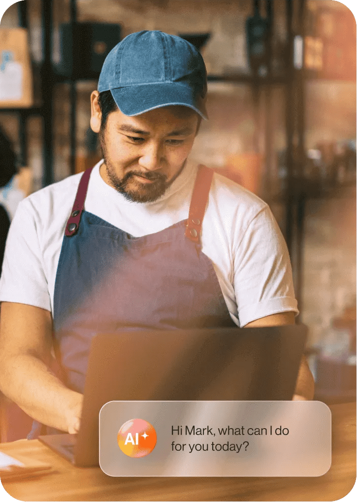 A banking customer interacting with a conversational AI chatbot via their laptop