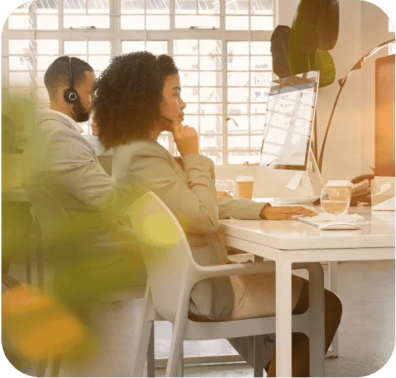 Two human support agents handling high-value customer calls delivered with full context delivered via conversational AI