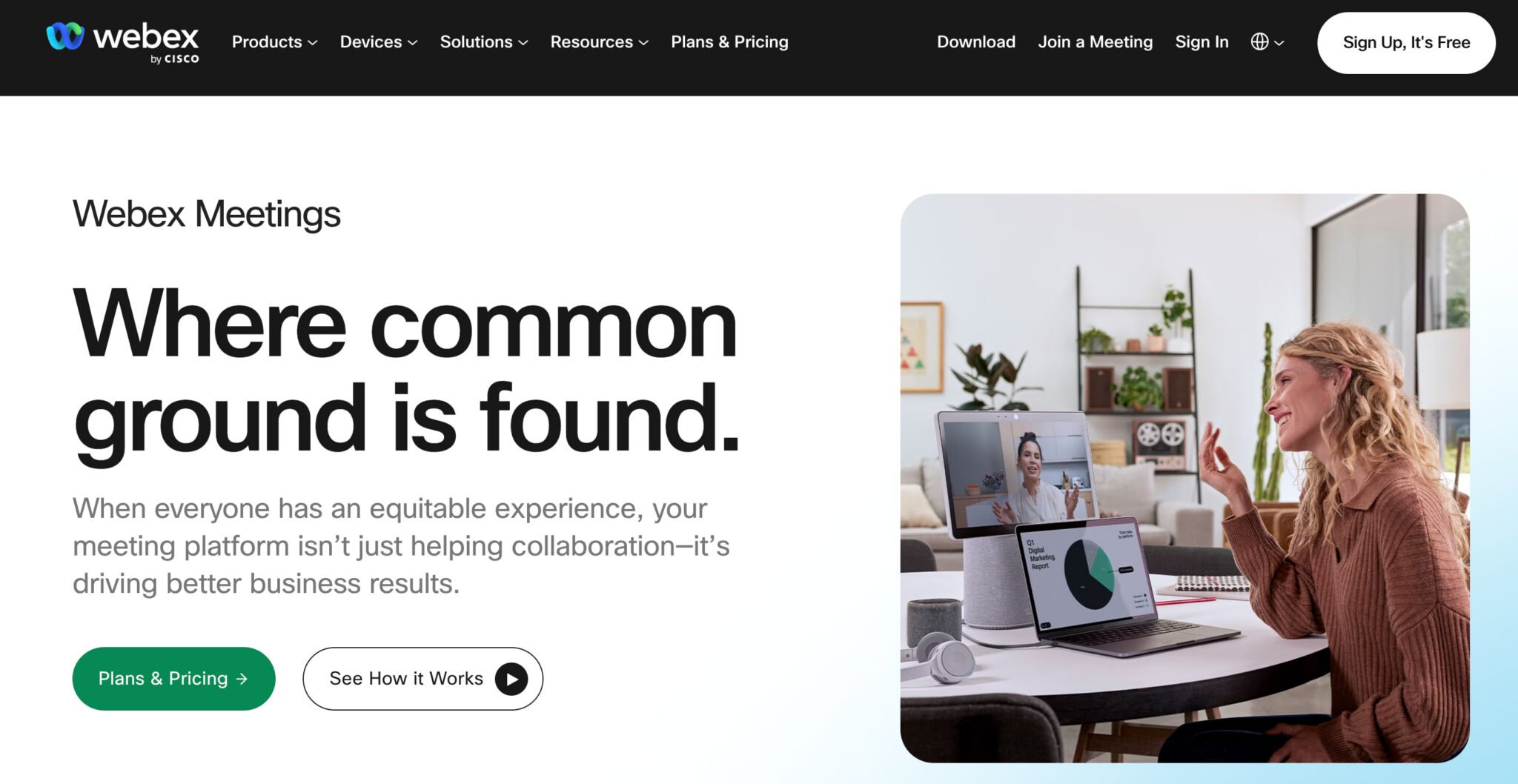 The Webex Meetings homepage, showing a woman at a desk chatting with a coworker via video