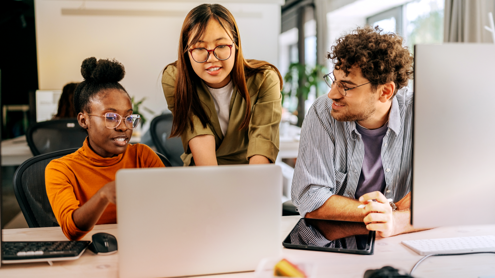 Three students at computer RingCentral ACE